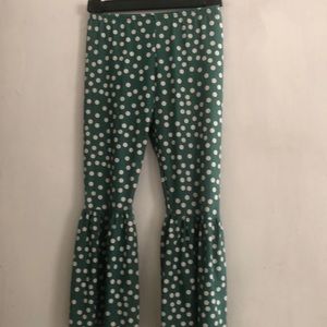 Green with cream polka dots bell bottom pants in size 7-8T.